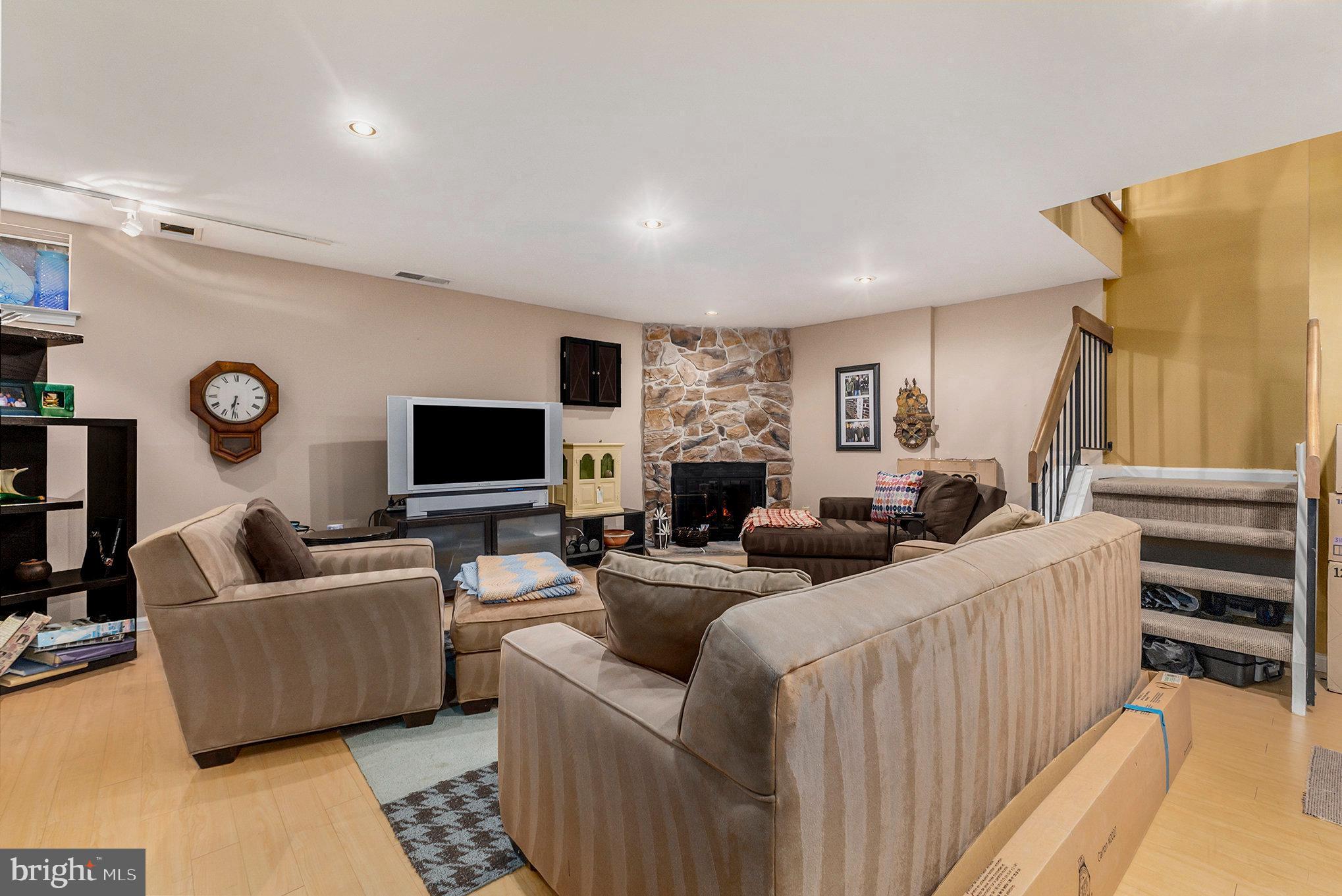 6 Lantern Lane Chesterbrook, PA 19087 - Photo 27 of 37 a living room with furniture and a flat screen tv