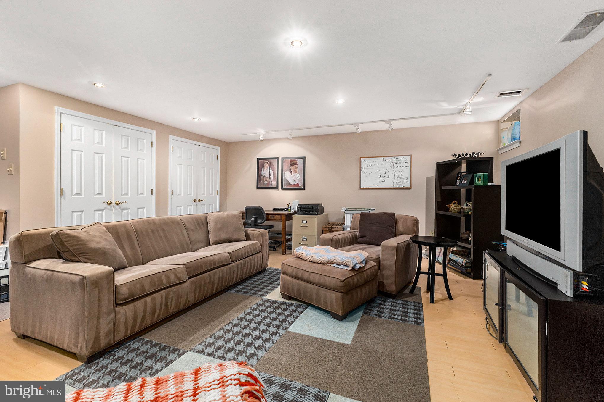 6 Lantern Lane Chesterbrook, PA 19087 - Photo 28 of 37 a living room with furniture and a flat screen tv