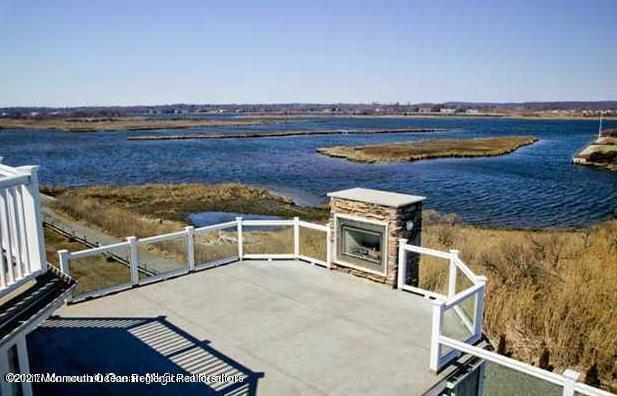 13 Riverview Road Monmouth Beach, NJ 07750 - Photo 5 of 5 a view of a swimming pool with seating space
