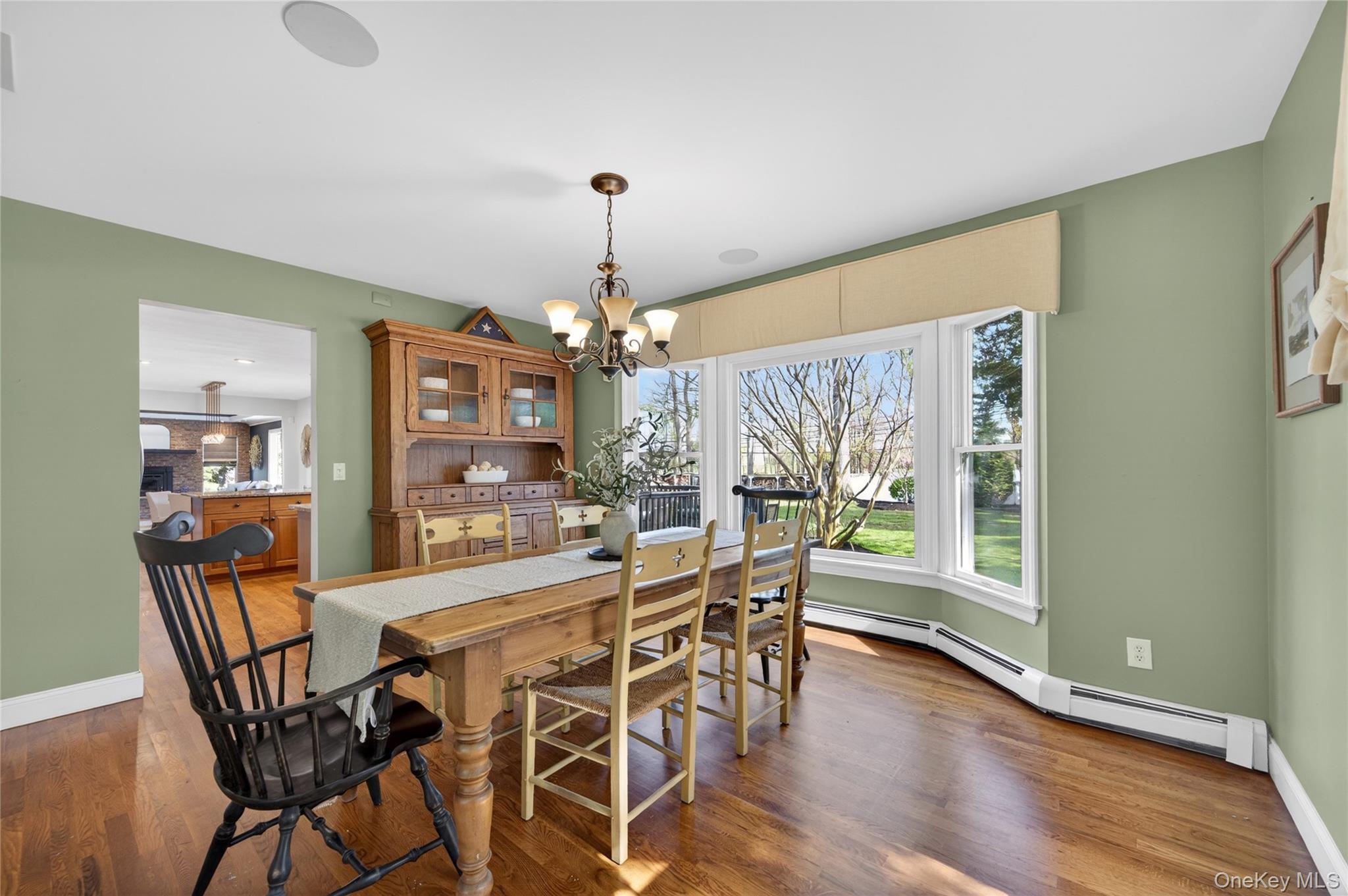 21 Midland Street Cold Spring Harbor, NY 11724 - Photo 11 of 44 a view of a dining room with furniture window and wooden floor