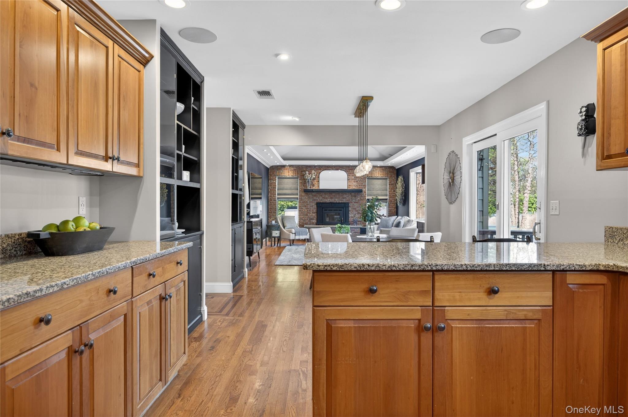 21 Midland Street Cold Spring Harbor, NY 11724 - Photo 12 of 44 a kitchen with stainless steel appliances granite countertop cabinets and wooden floor