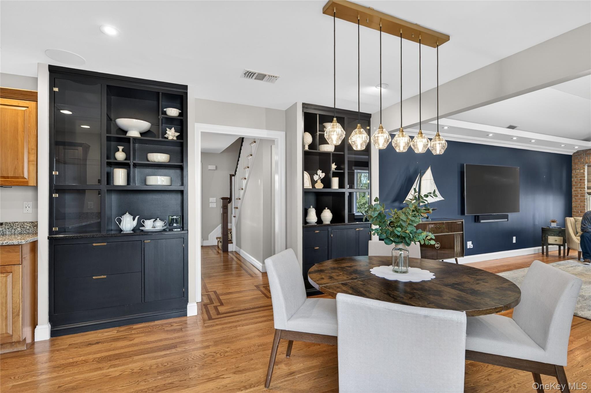 21 Midland Street Cold Spring Harbor, NY 11724 - Photo 16 of 44 a view of a dining room with furniture and wooden floor