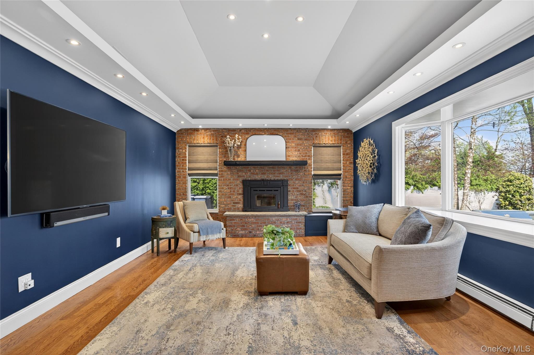 21 Midland Street Cold Spring Harbor, NY 11724 - Photo 19 of 44 a living room with furniture flat screen tv and a large window