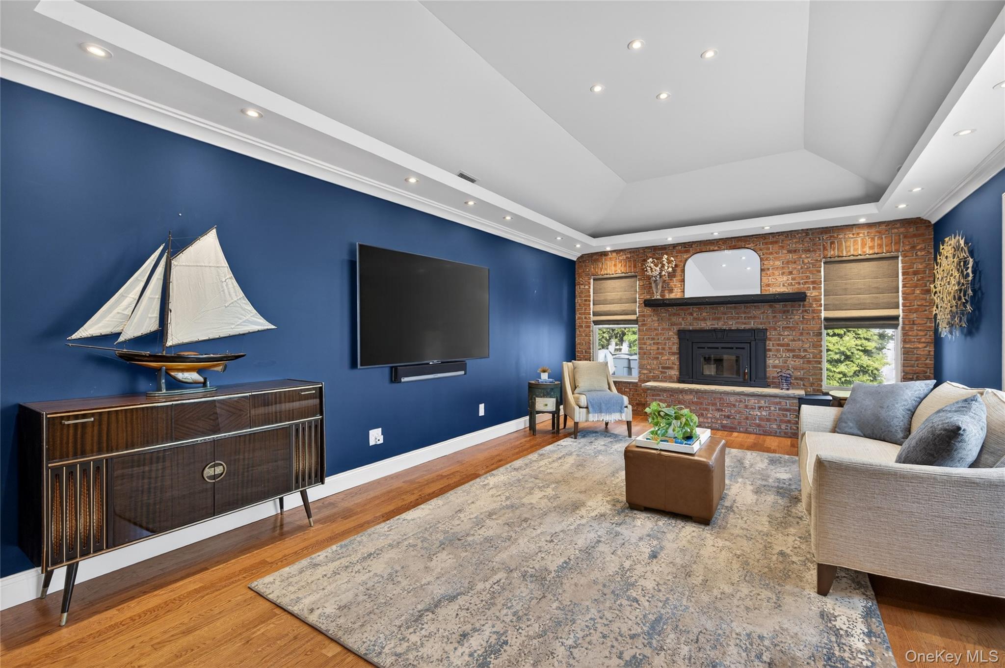 21 Midland Street Cold Spring Harbor, NY 11724 - Photo 20 of 44 a living room with furniture and a flat screen tv