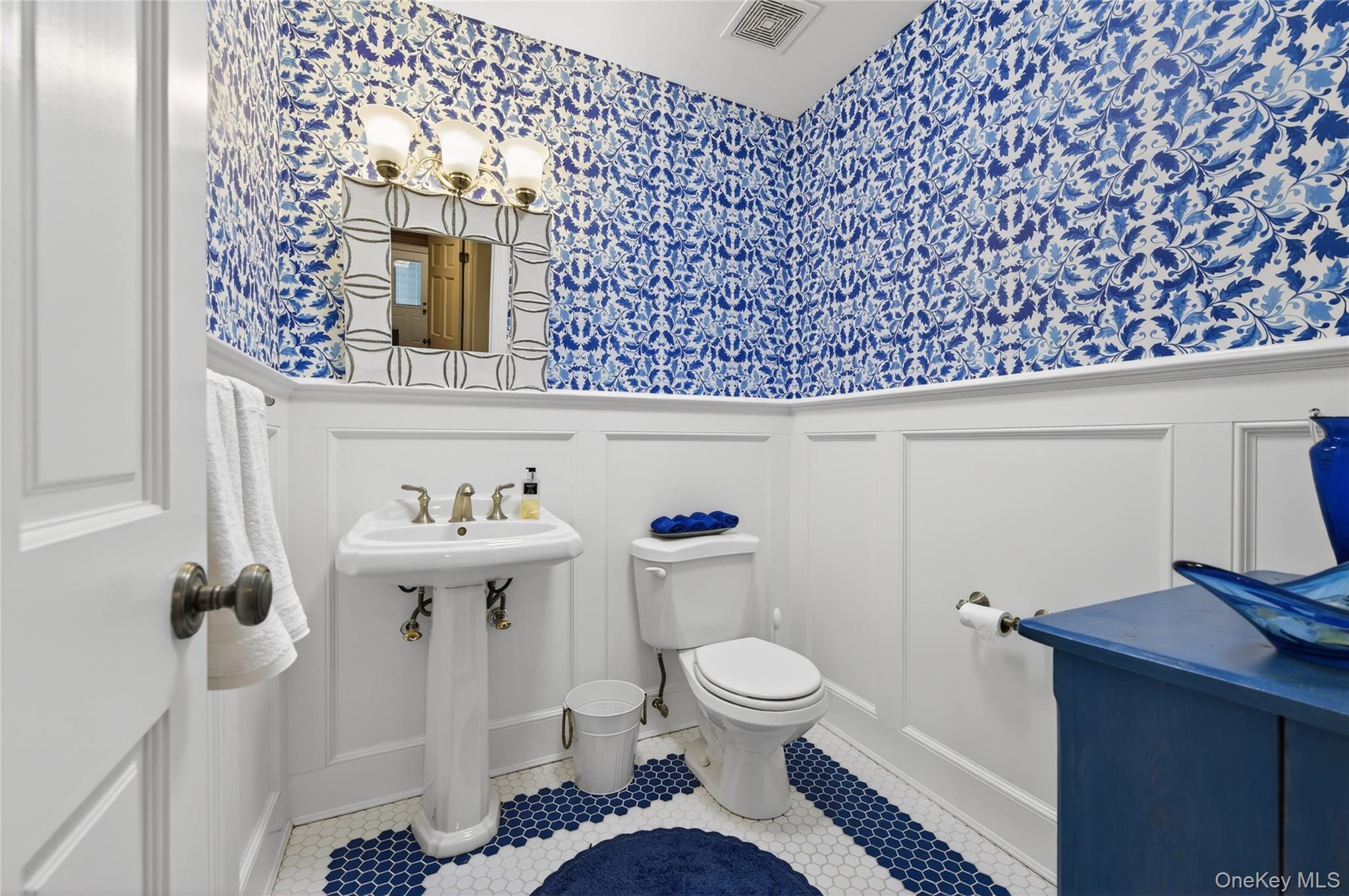 21 Midland Street Cold Spring Harbor, NY 11724 - Photo 22 of 44 a bathroom with a toilet a sink and mirror