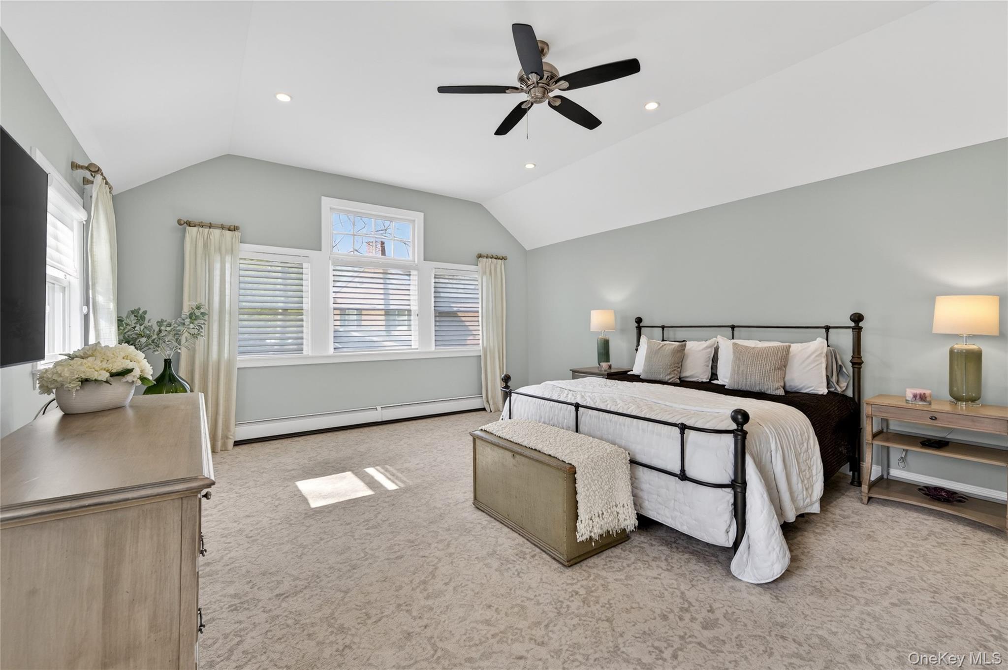 21 Midland Street Cold Spring Harbor, NY 11724 - Photo 23 of 44 a bedroom with a large bed and a couch