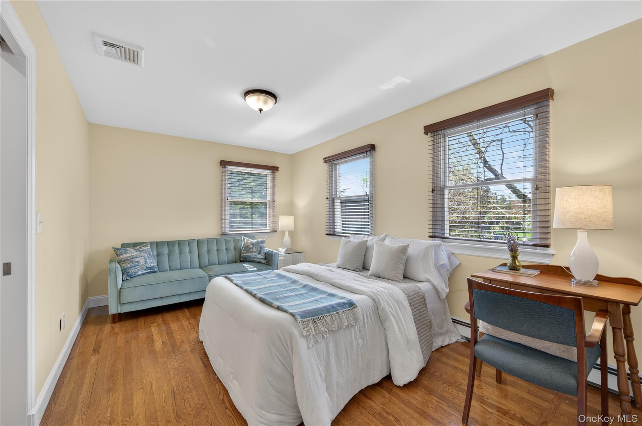 21 Midland Street Cold Spring Harbor, NY 11724 - Photo 27 of 44 a bedroom with a bed and a window