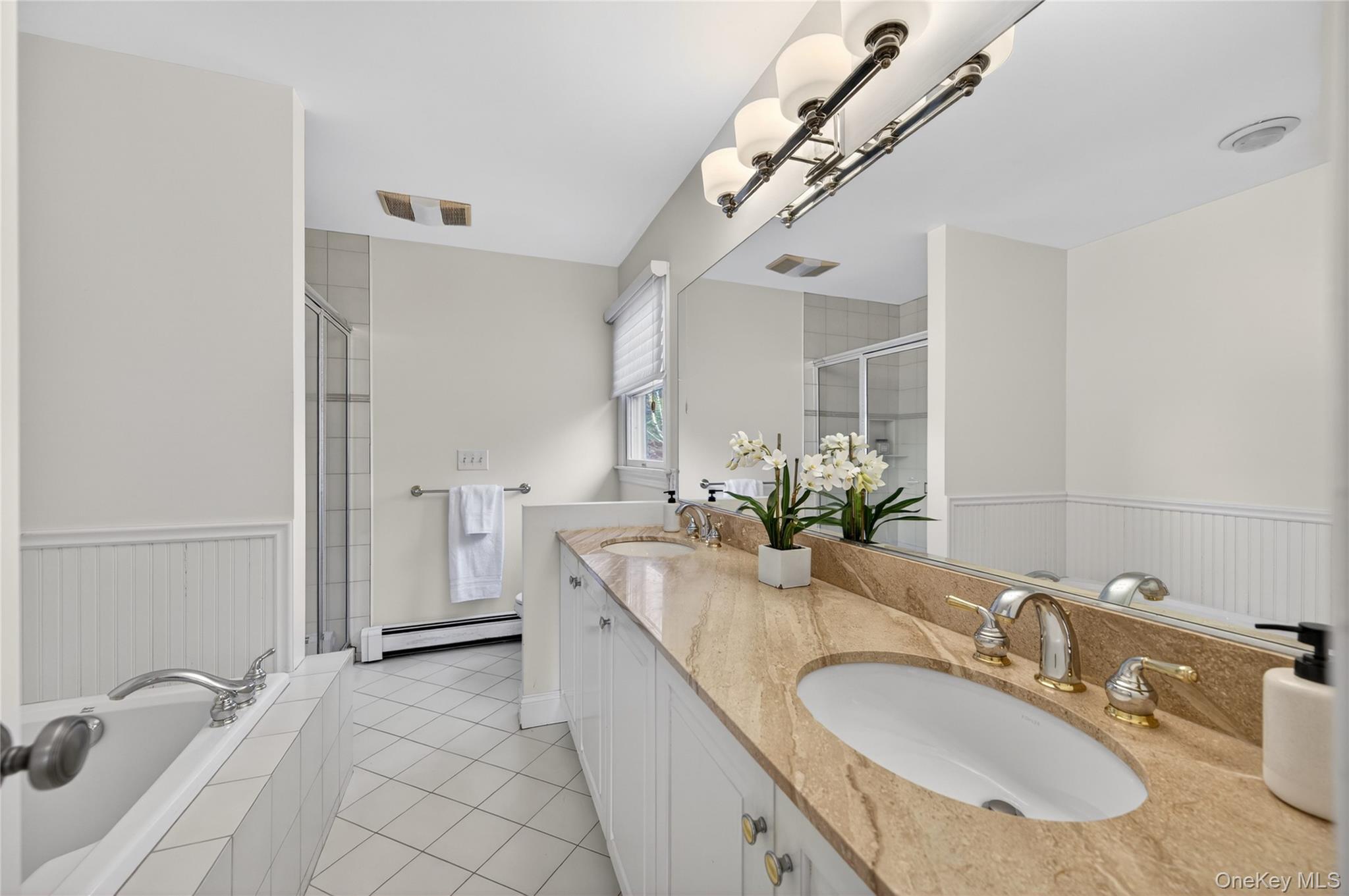21 Midland Street Cold Spring Harbor, NY 11724 - Photo 30 of 44 a bathroom with a granite countertop double vanity sink and a mirror