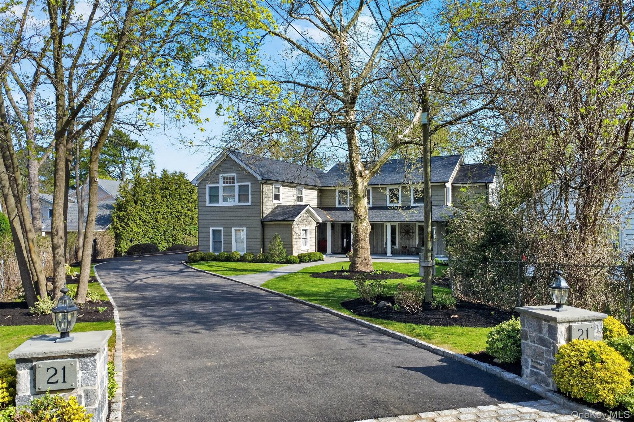 21 Midland Street Cold Spring Harbor, NY 11724 - Photo 3 of 44 a front view of a house with garden