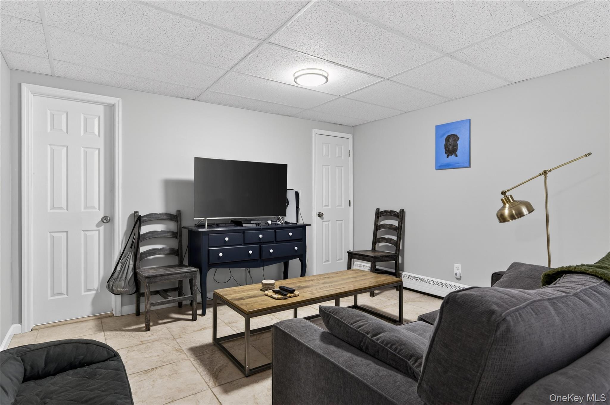 21 Midland Street Cold Spring Harbor, NY 11724 - Photo 33 of 44 a living room with furniture and a flat screen tv