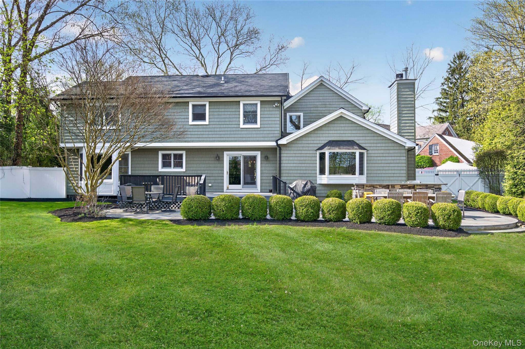 21 Midland Street Cold Spring Harbor, NY 11724 - Photo 34 of 44 a view of house with a big yard and potted plants