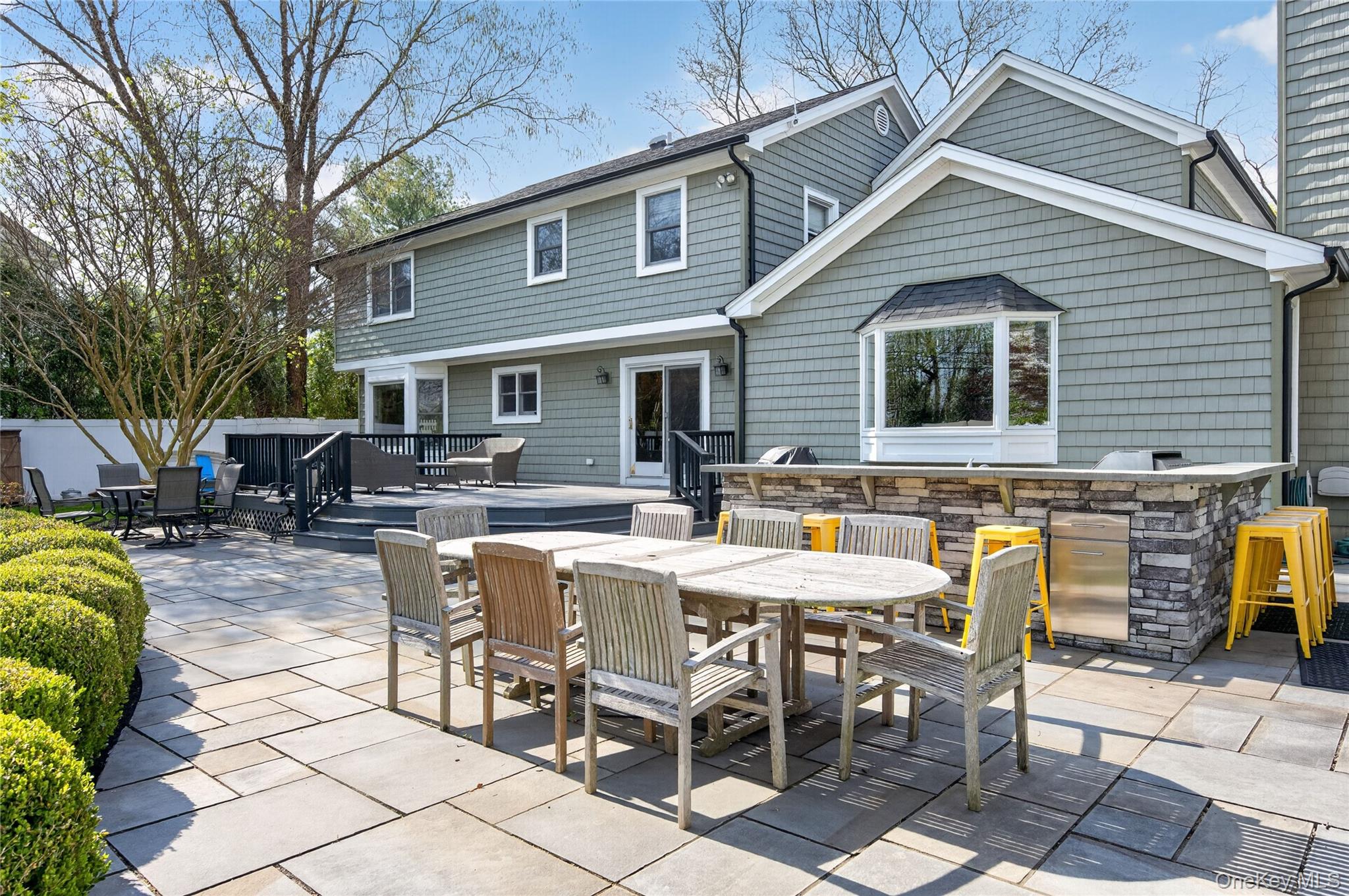 21 Midland Street Cold Spring Harbor, NY 11724 - Photo 36 of 44 a view of a dinning table and chairs in the patio