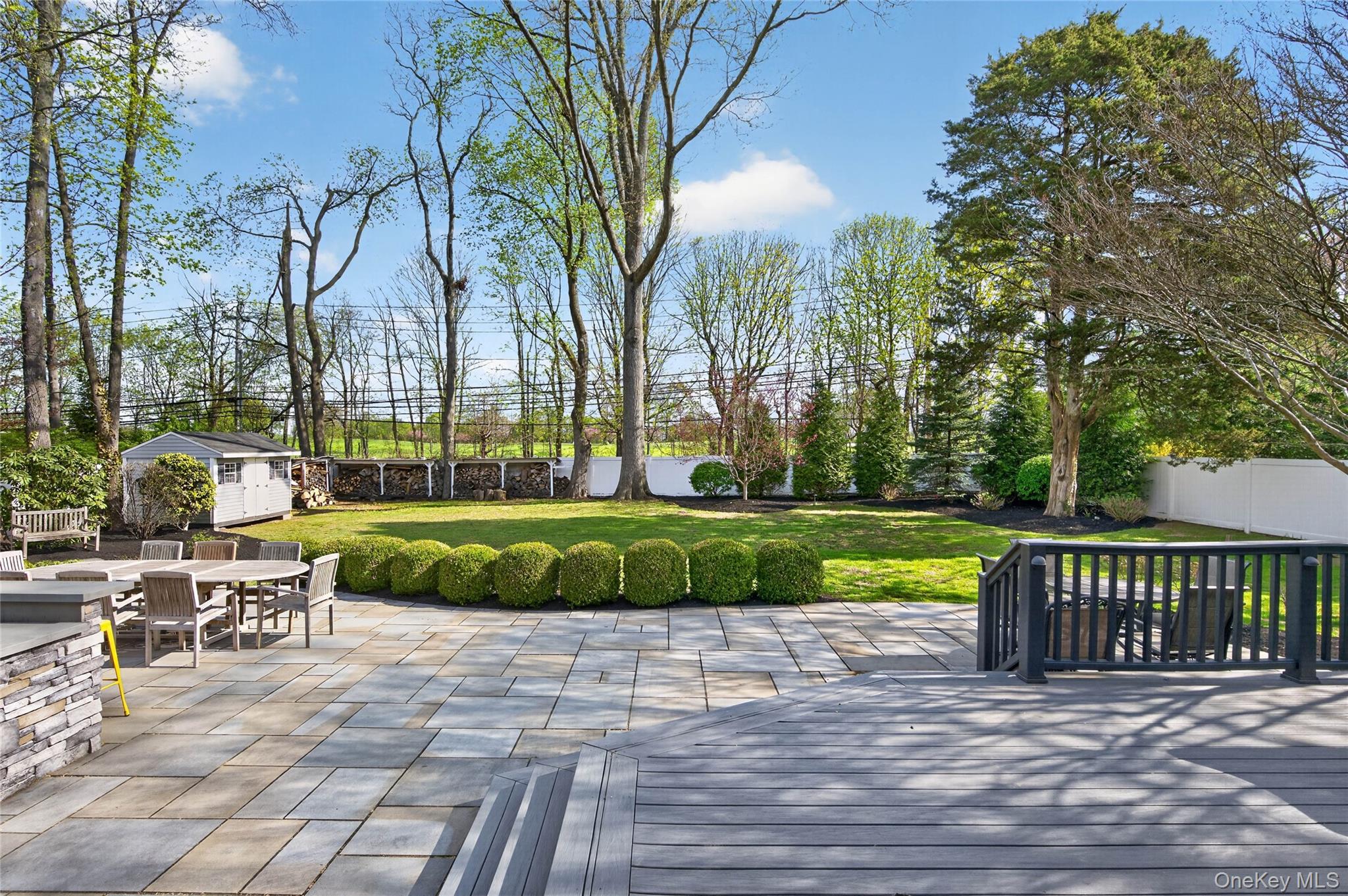 21 Midland Street Cold Spring Harbor, NY 11724 - Photo 38 of 44 a view of a swimming pool with a patio and a garden