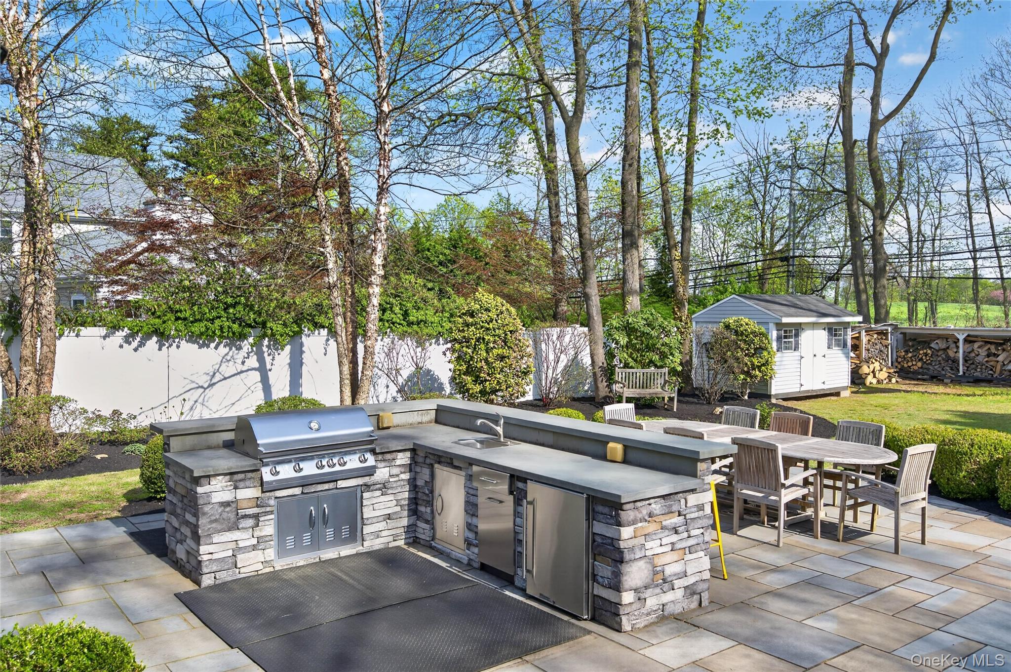 21 Midland Street Cold Spring Harbor, NY 11724 - Photo 39 of 44 a view of a patio with table and chairs and couches
