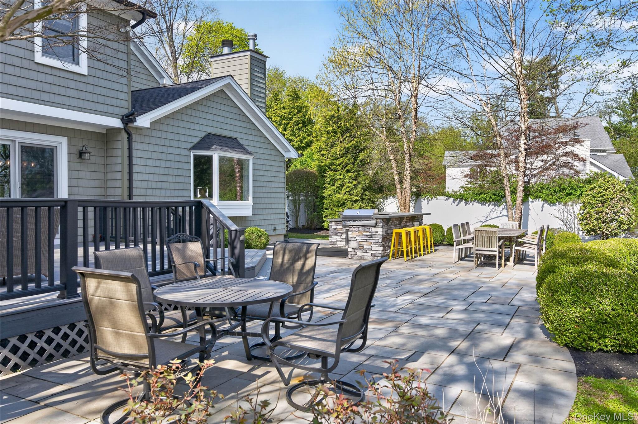 21 Midland Street Cold Spring Harbor, NY 11724 - Photo 40 of 44 a view of a chairs and table in the patio