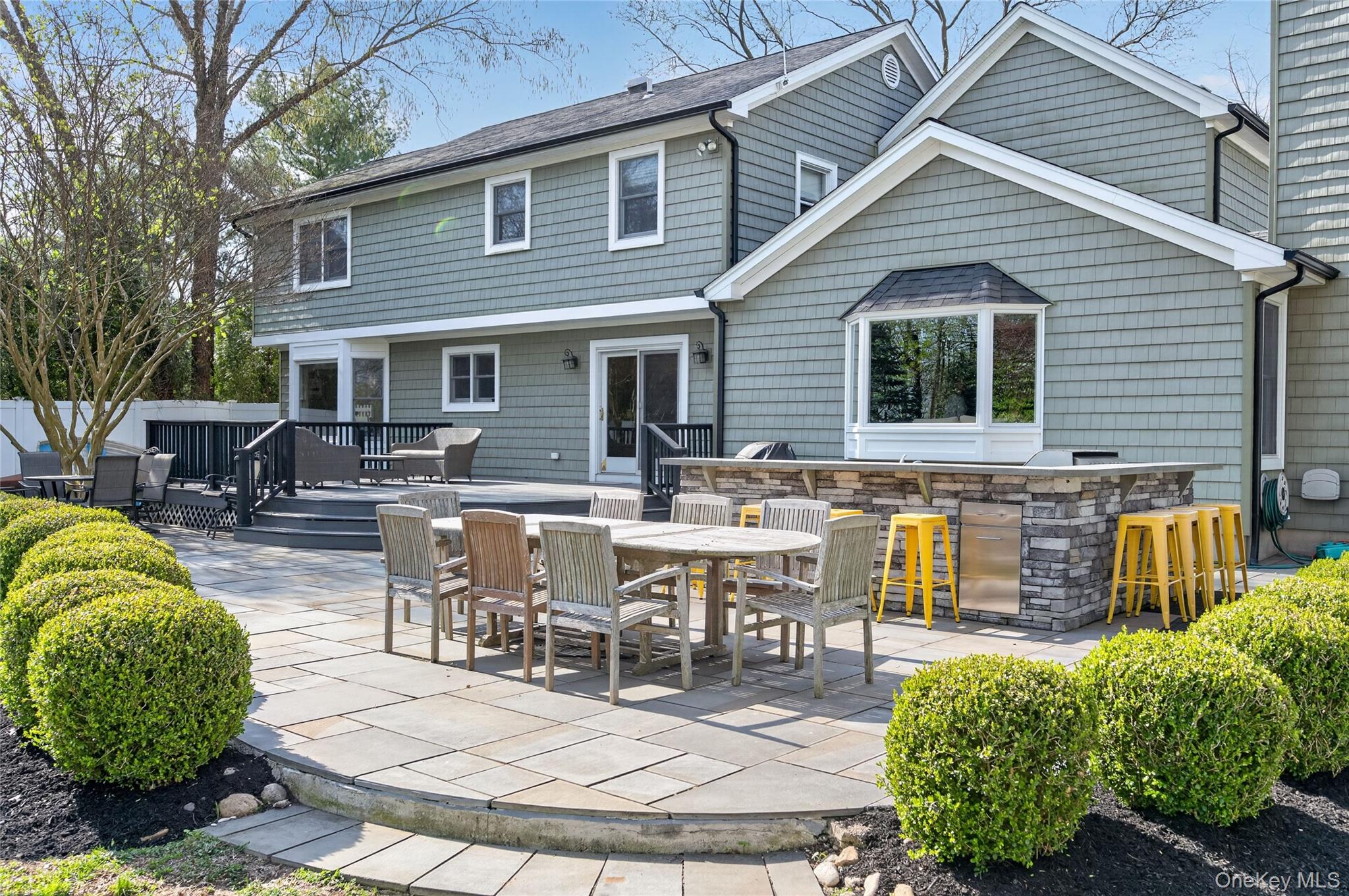 21 Midland Street Cold Spring Harbor, NY 11724 - Photo 41 of 44 a view of a dinning table and chairs in the patio