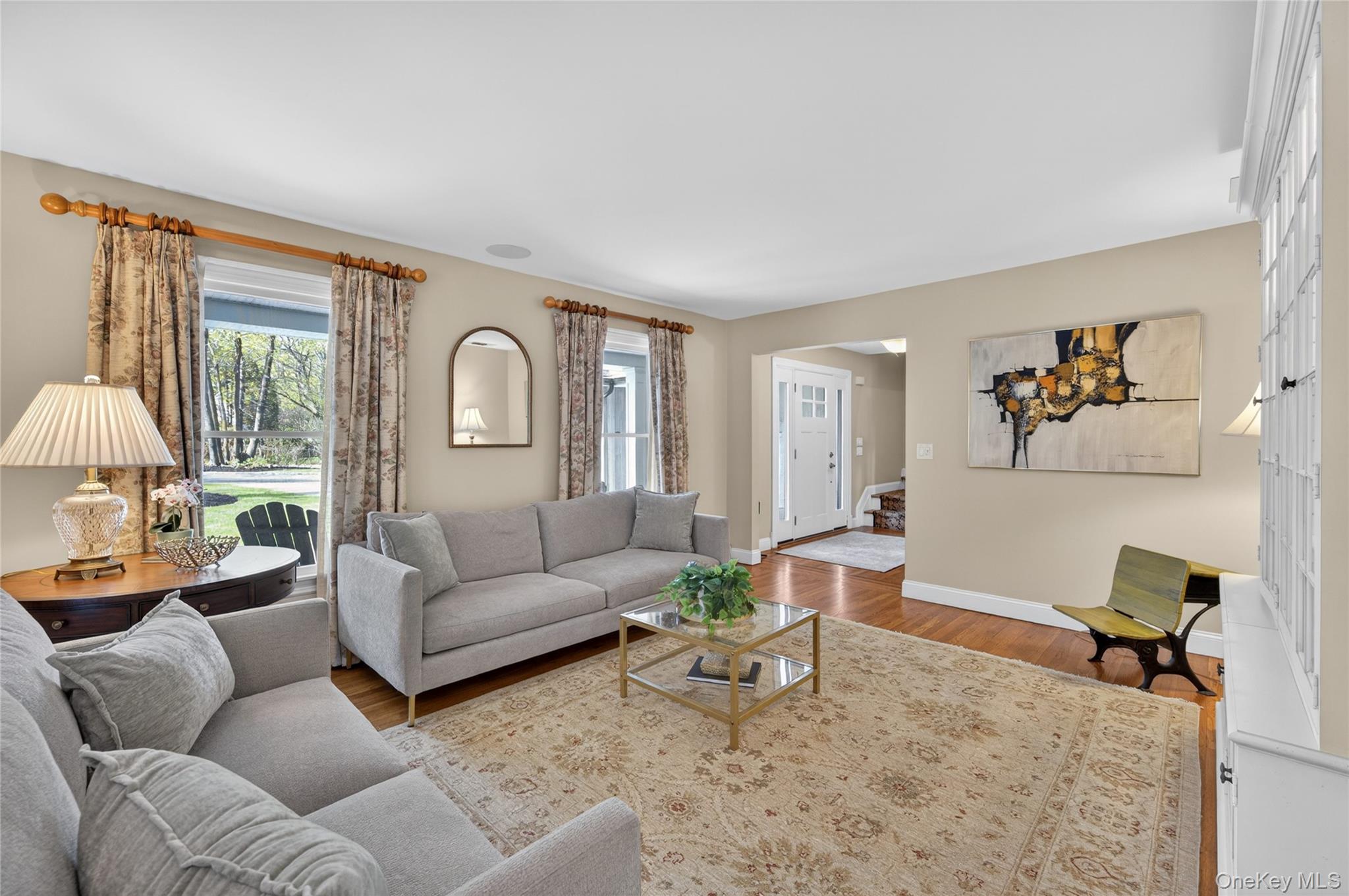 21 Midland Street Cold Spring Harbor, NY 11724 - Photo 9 of 44 a living room with furniture and a large window