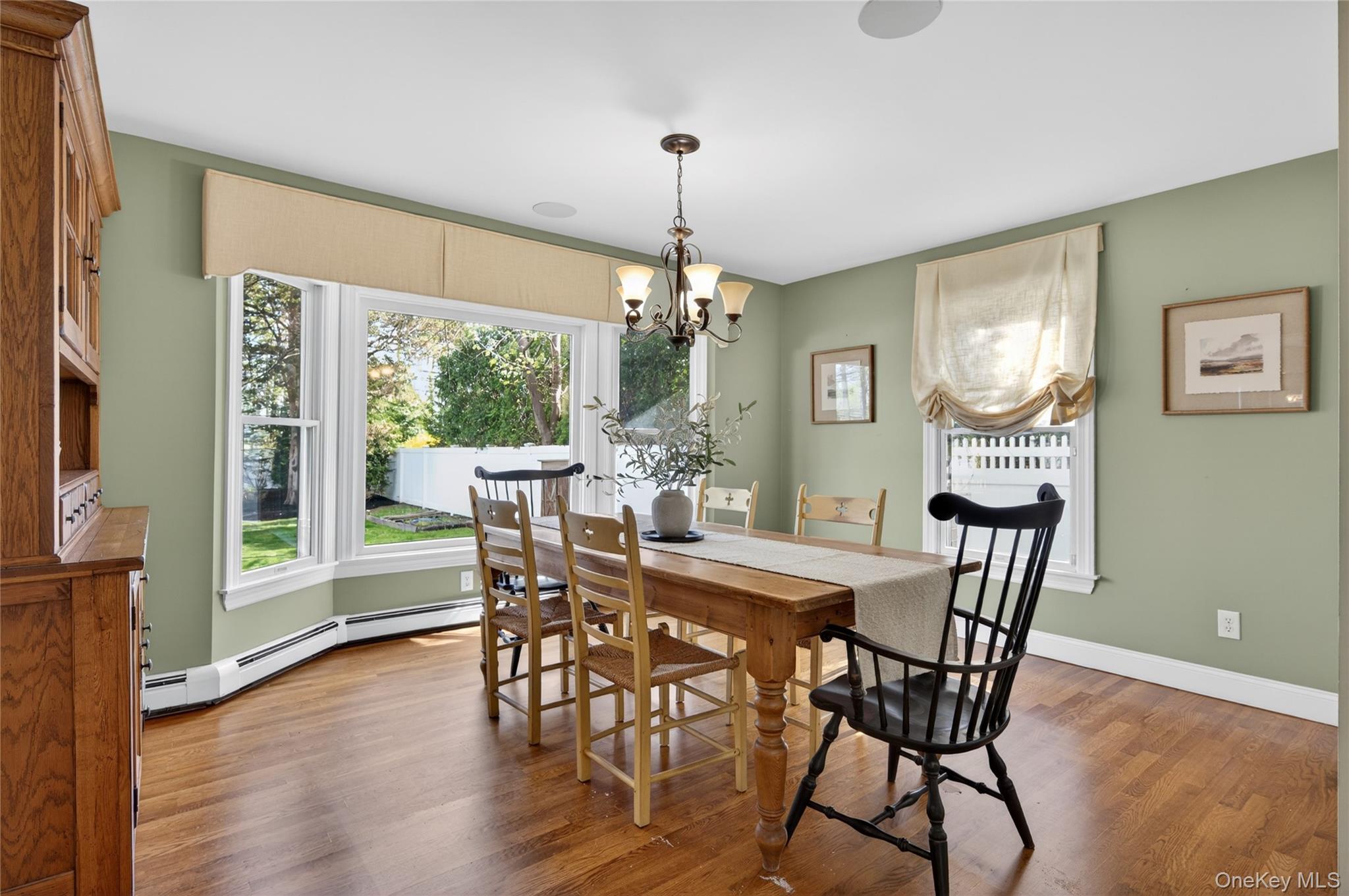 21 Midland Street Cold Spring Harbor, NY 11724 - Photo 10 of 44 a view of a dining room with furniture window and wooden floor