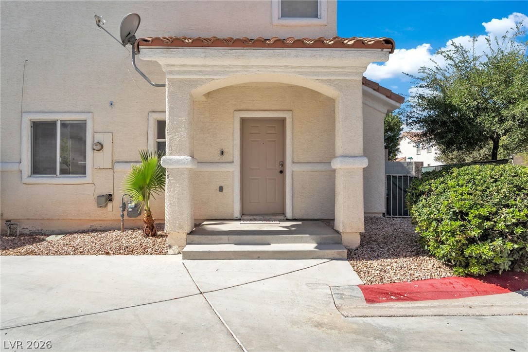 This inviting entrance features a covered porch, offering both charm and protection.