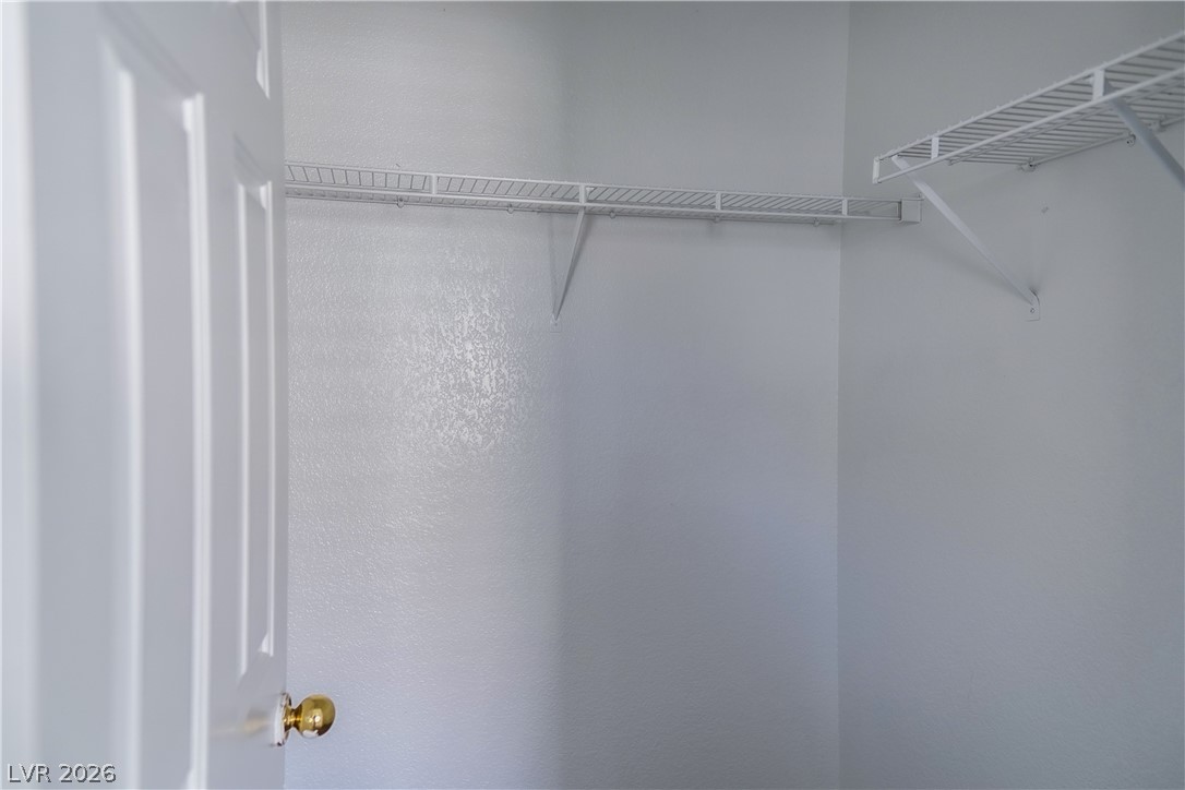 1409 Sycamore Spring Court Las Vegas, NV 89128 - Photo 20 of 28 This spacious closet features ample shelving for organized storage.
