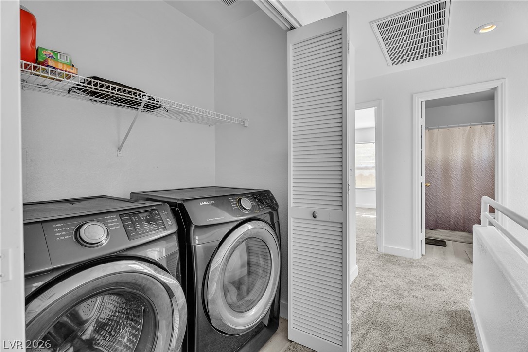 1409 Sycamore Spring Court Las Vegas, NV 89128 - Photo 23 of 28 This dedicated laundry space offers convenience and efficiency for daily chores.