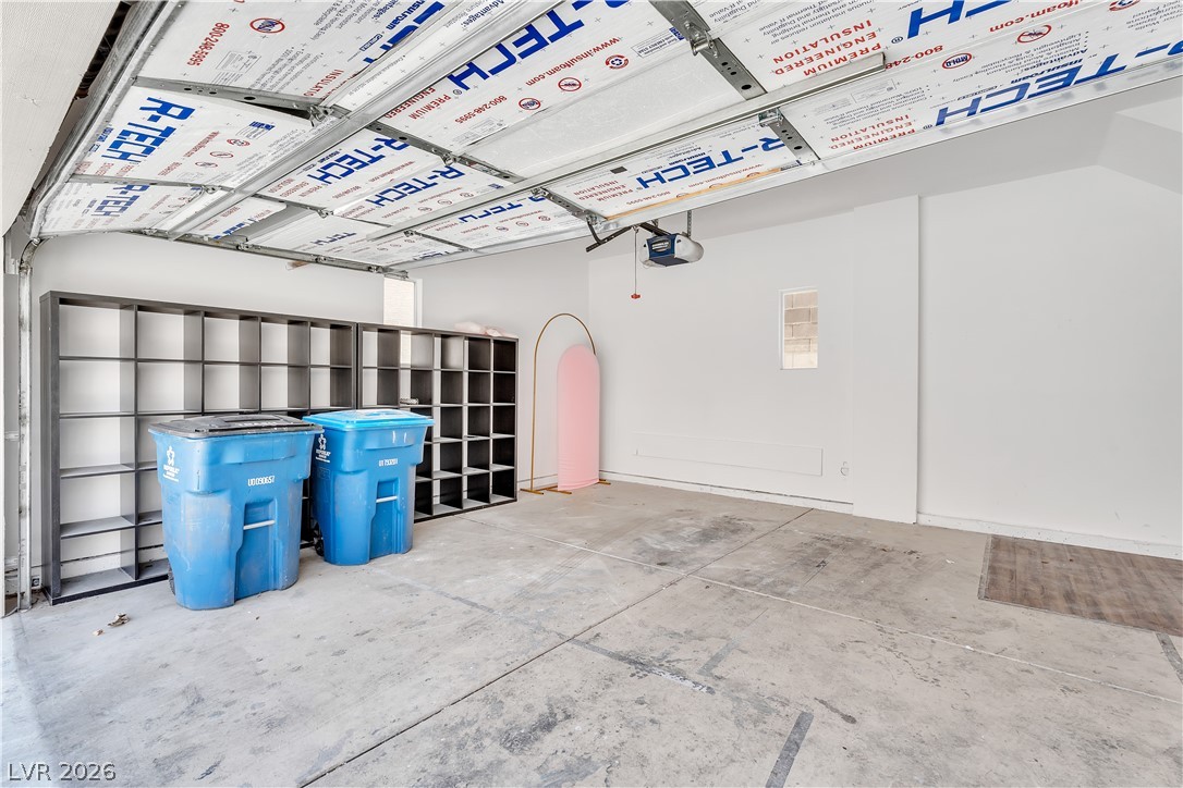 1409 Sycamore Spring Court Las Vegas, NV 89128 - Photo 24 of 28 This spacious garage offers ample room and direct access to the home.