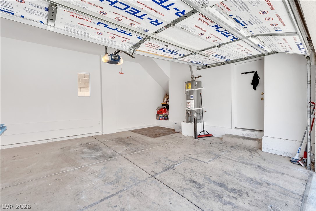 1409 Sycamore Spring Court Las Vegas, NV 89128 - Photo 25 of 28 This spacious garage offers practical utility and easy access for vehicles and storage.
