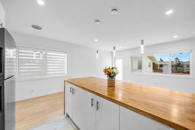 a view of kitchen with wooden floor