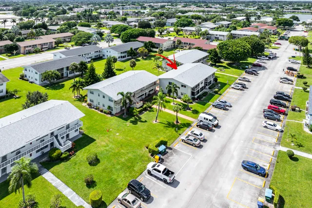 an aerial view of house with yard and swimming pool