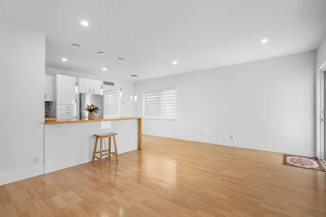 a view of kitchen with furniture and wooden floor