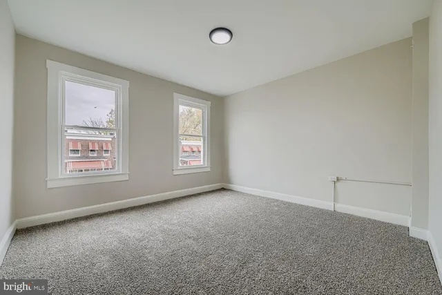 an empty room with windows