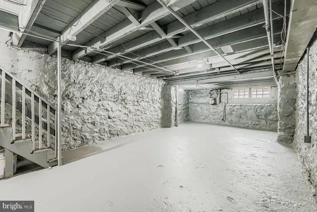 a view of empty room with wooden walls