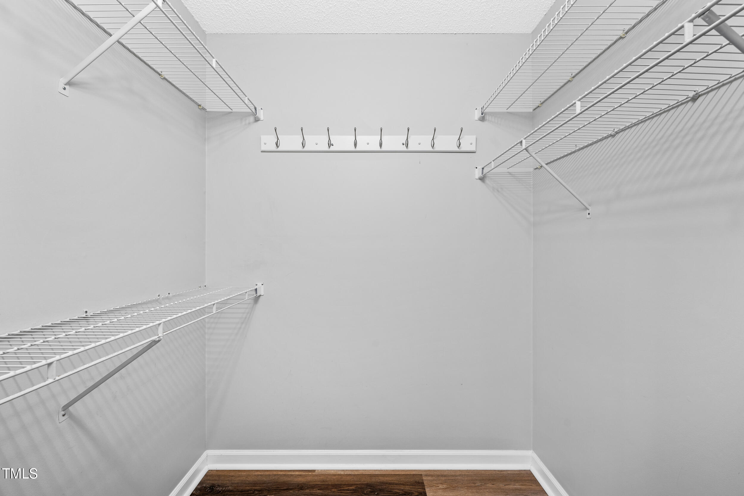 2213 Bufflehead Road Raleigh, NC 27616 - Photo 18 of 30 a view of walk in closet with empty racks