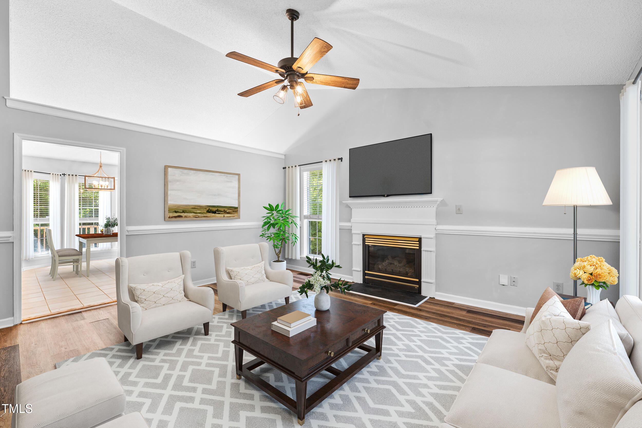2213 Bufflehead Road Raleigh, NC 27616 - Photo 5 of 30 a living room with furniture a fireplace with a flat screen tv