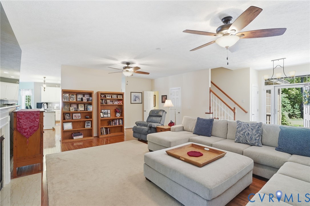 3600 Market Road Mechanicsville, VA 23111 - Photo 12 of 67 a living room with furniture and a dining table with bookshelf