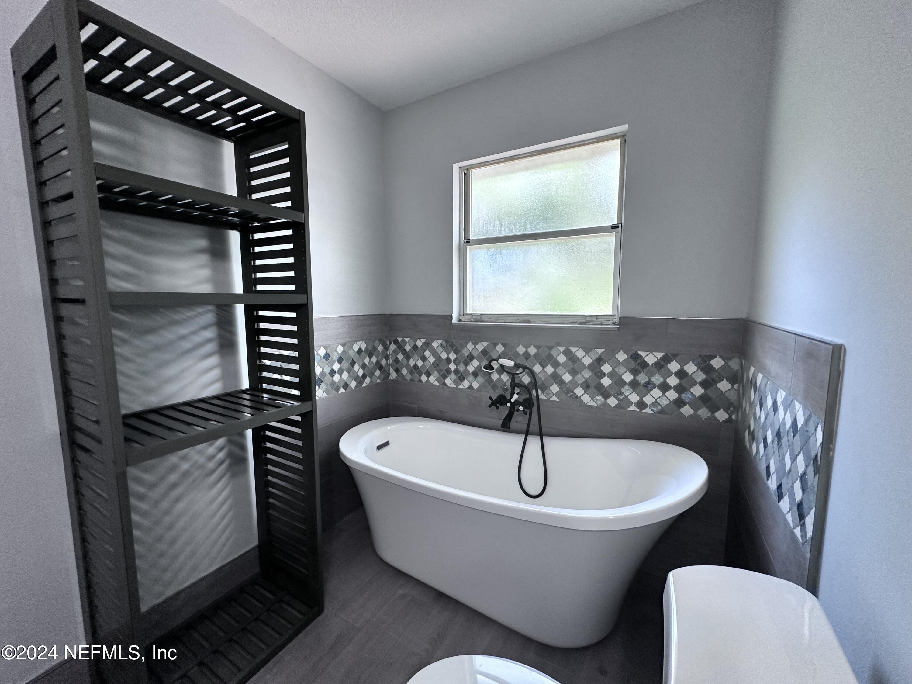 4521 Trevi Drive Jacksonville, FL 32257 - Photo 15 of 24 a bathroom with a bathtub and a sink