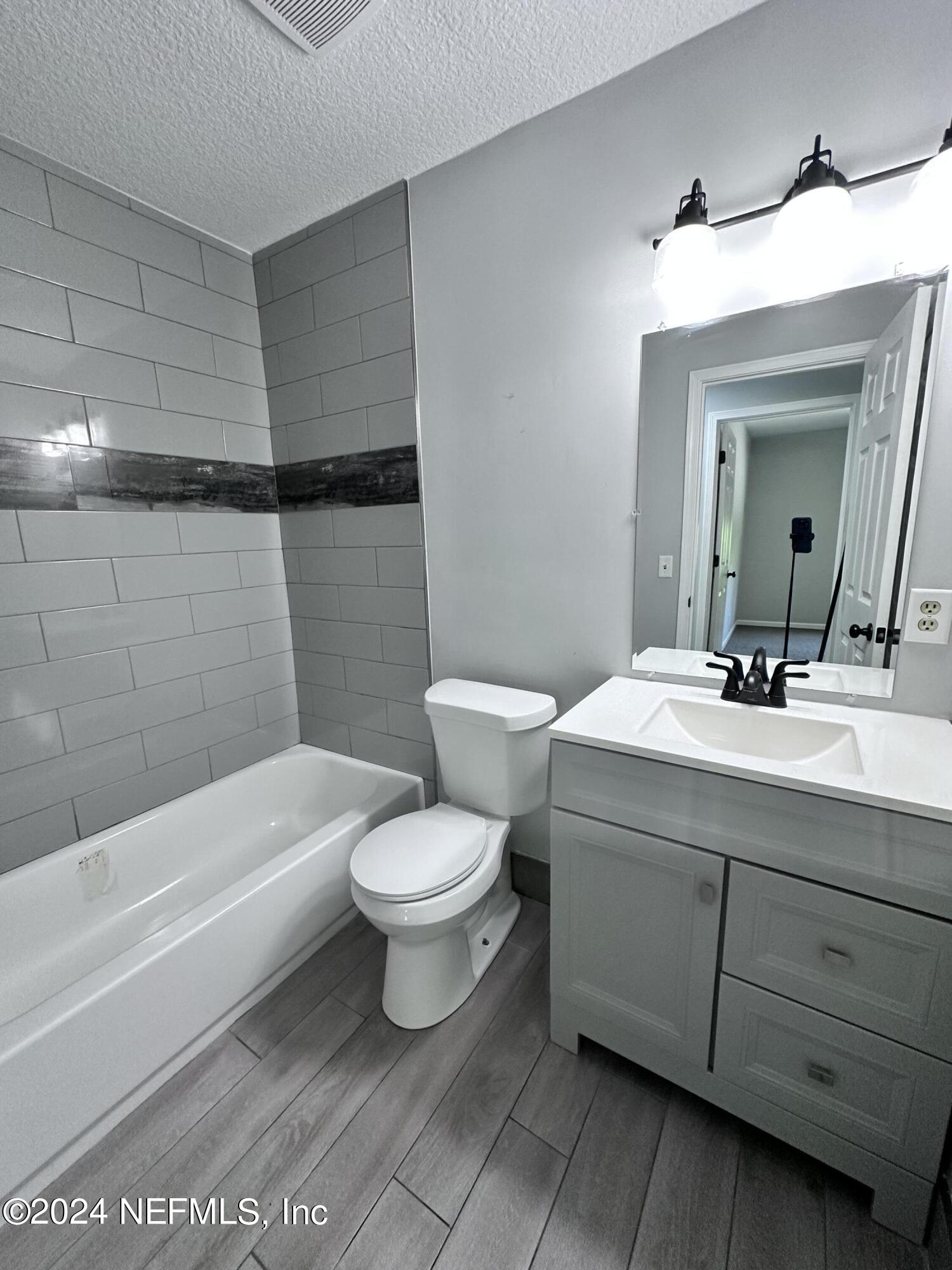 4521 Trevi Drive Jacksonville, FL 32257 - Photo 20 of 24 a bathroom with a sink a toilet and bathtub