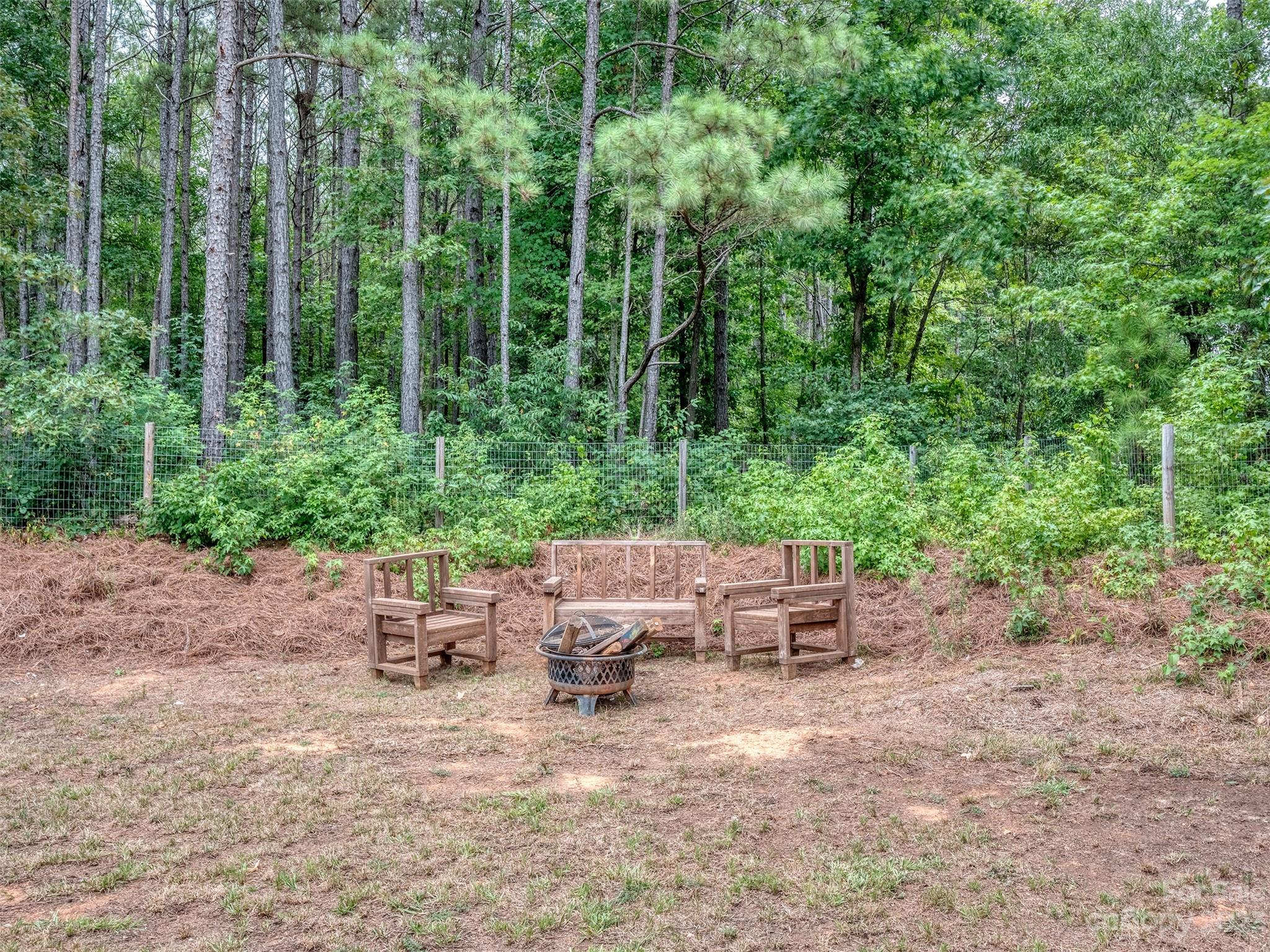 1051 Duckwood Road Lancaster, SC 29720 - Photo 17 of 18 a backyard of a house with lots of green space