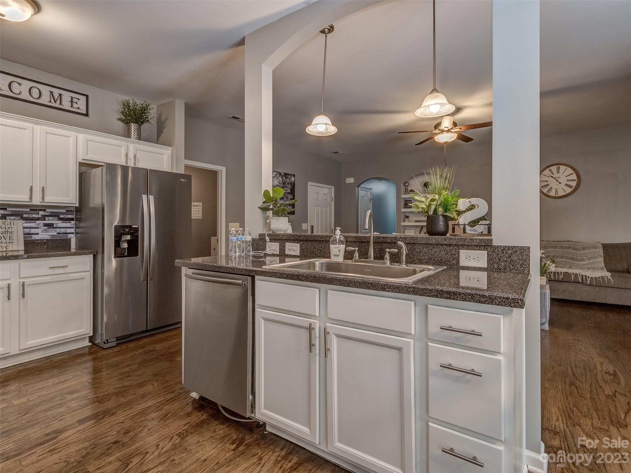 1051 Duckwood Road Lancaster, SC 29720 - Photo 10 of 18 a kitchen with kitchen island white cabinets and stainless steel appliances