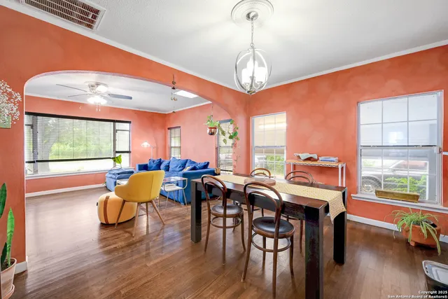 a view of a dining room with furniture window and wooden floor