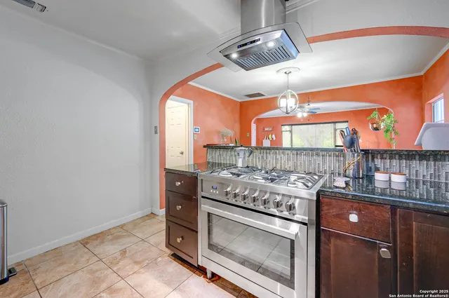 a kitchen with a stove and a microwave