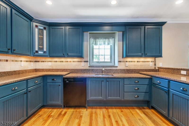 16 Main Street Sparta, NJ 07871 - Photo 8 of 33 a kitchen with wooden cabinets and a sink