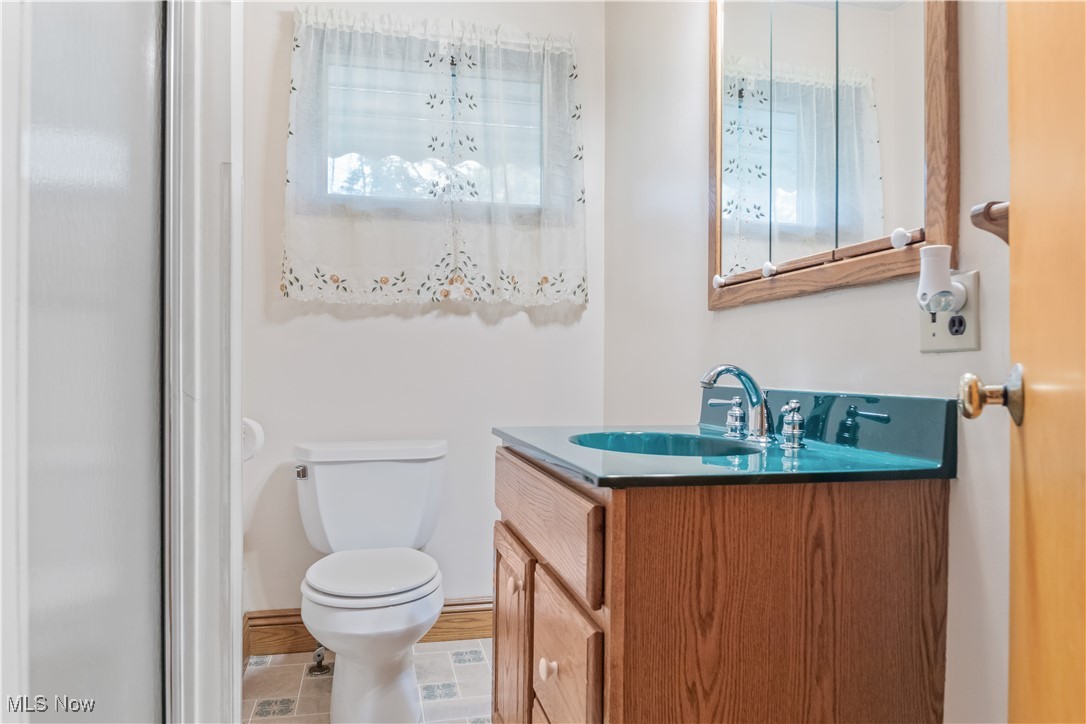 900 Ryan Road Medina, OH 44256 - Photo 21 of 40 Bathroom featuring tile patterned floors, vanity, and toilet