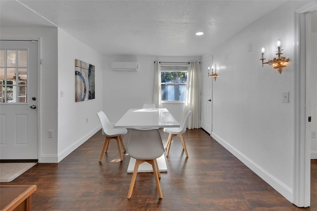 115 Juan Road DeBary, FL 32713 - Photo 16 of 41 a view of a dining room with furniture and wooden floor