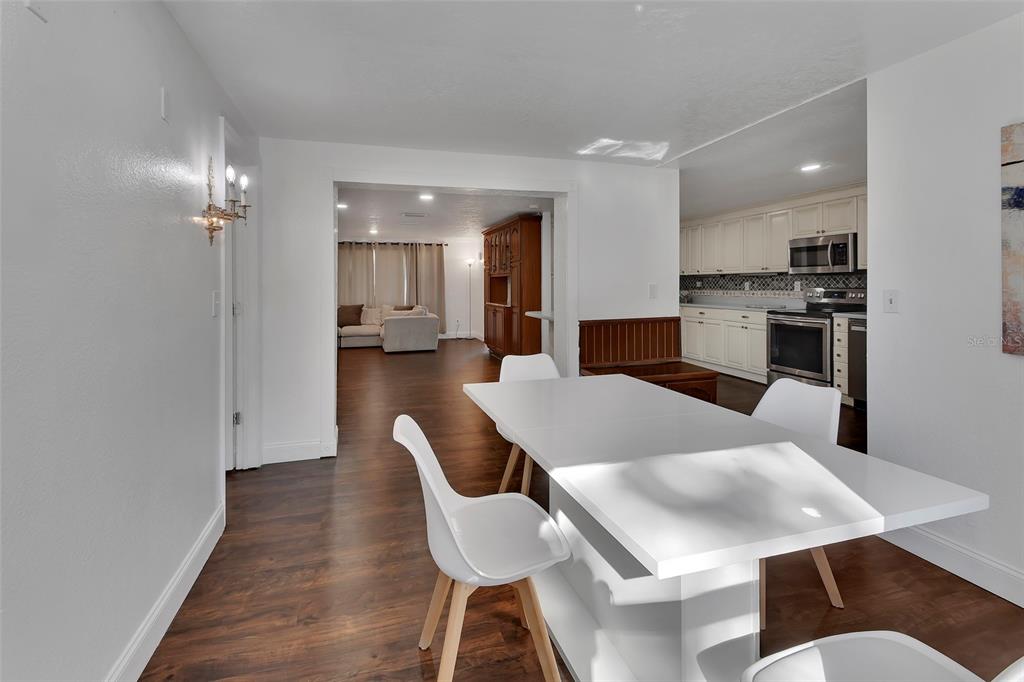 115 Juan Road DeBary, FL 32713 - Photo 17 of 41 a living room with stainless steel appliances furniture a dining table and kitchen view