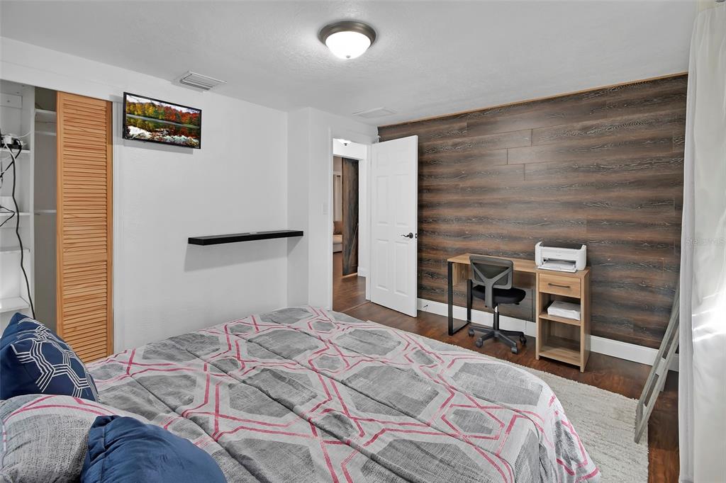 115 Juan Road DeBary, FL 32713 - Photo 19 of 41 a bedroom with a bed and a chair