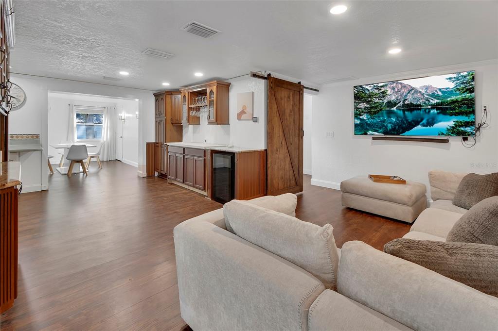 115 Juan Road DeBary, FL 32713 - Photo 2 of 41 a living room with furniture and a wooden floor