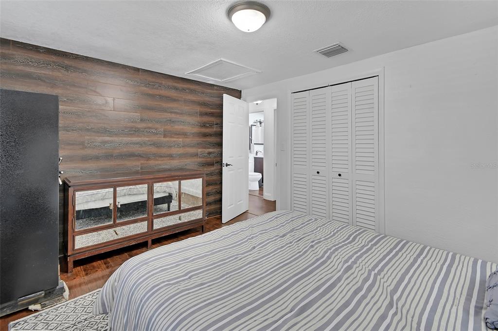 115 Juan Road DeBary, FL 32713 - Photo 22 of 41 a bedroom with a bed and a window