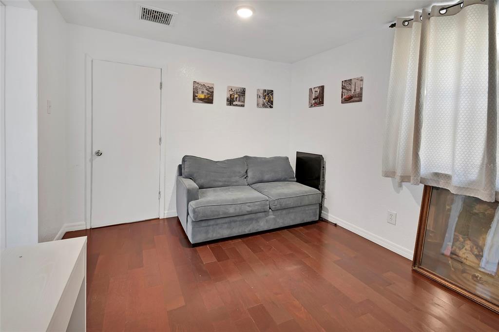 115 Juan Road DeBary, FL 32713 - Photo 24 of 41 a living room with furniture and a window