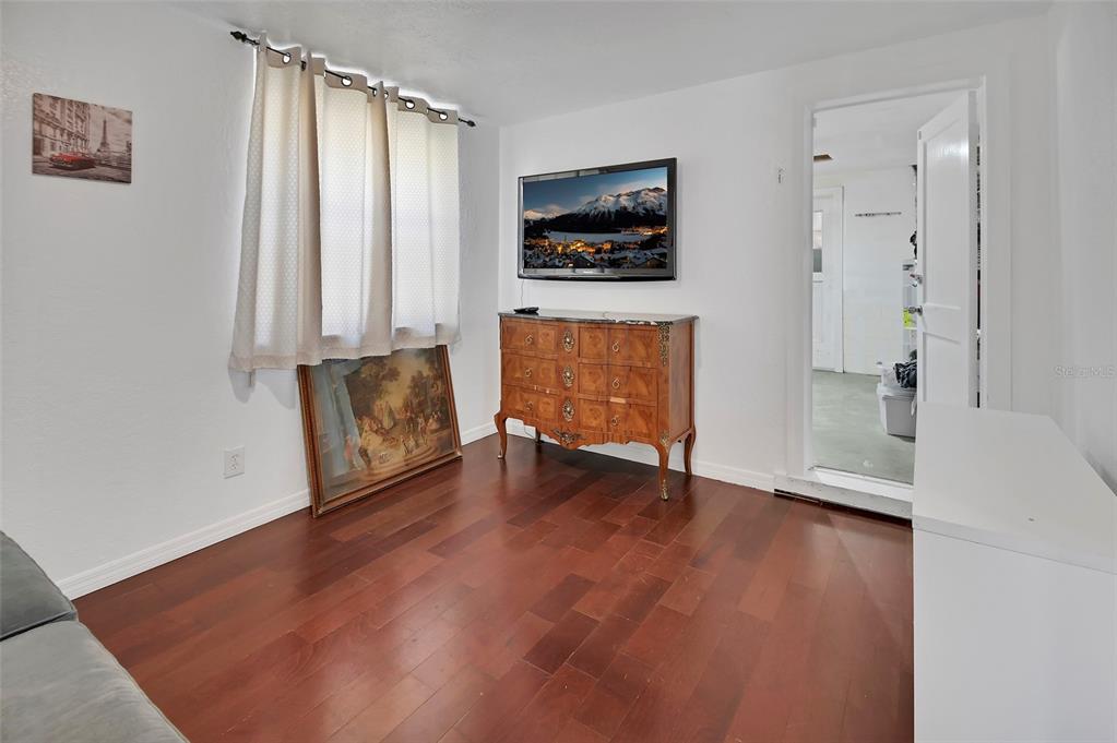 115 Juan Road DeBary, FL 32713 - Photo 25 of 41 a view of an empty room with a window and wooden floor